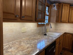 Back splash, counter top, cupboards and sink